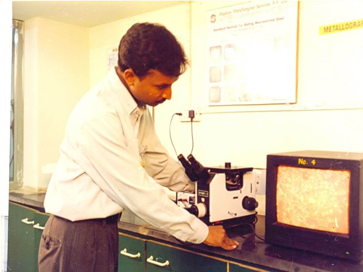 Metallurgist Examining Microstructure using Microscope