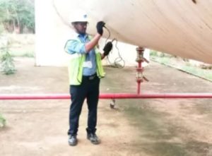 Inspector Performing Ultrasonic Thickness Gauging Service Onsite