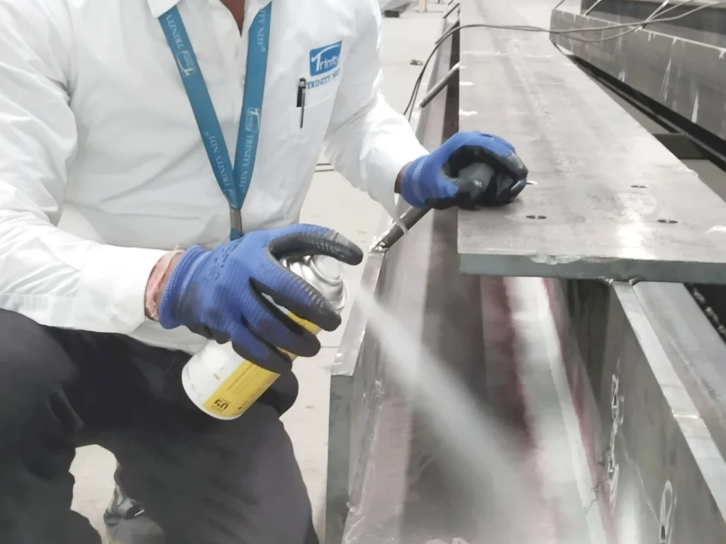 Dye penetrant inspection of welds